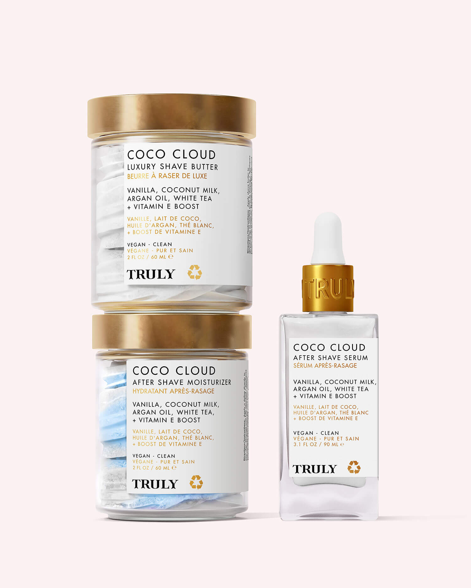 The Coco Cloud Shave Routine by Truly Beauty features two gold-lidded jars and a clear dropper bottle, all labeled vegan, clean, and sustainable—the ultimate skincare kit for shaving.