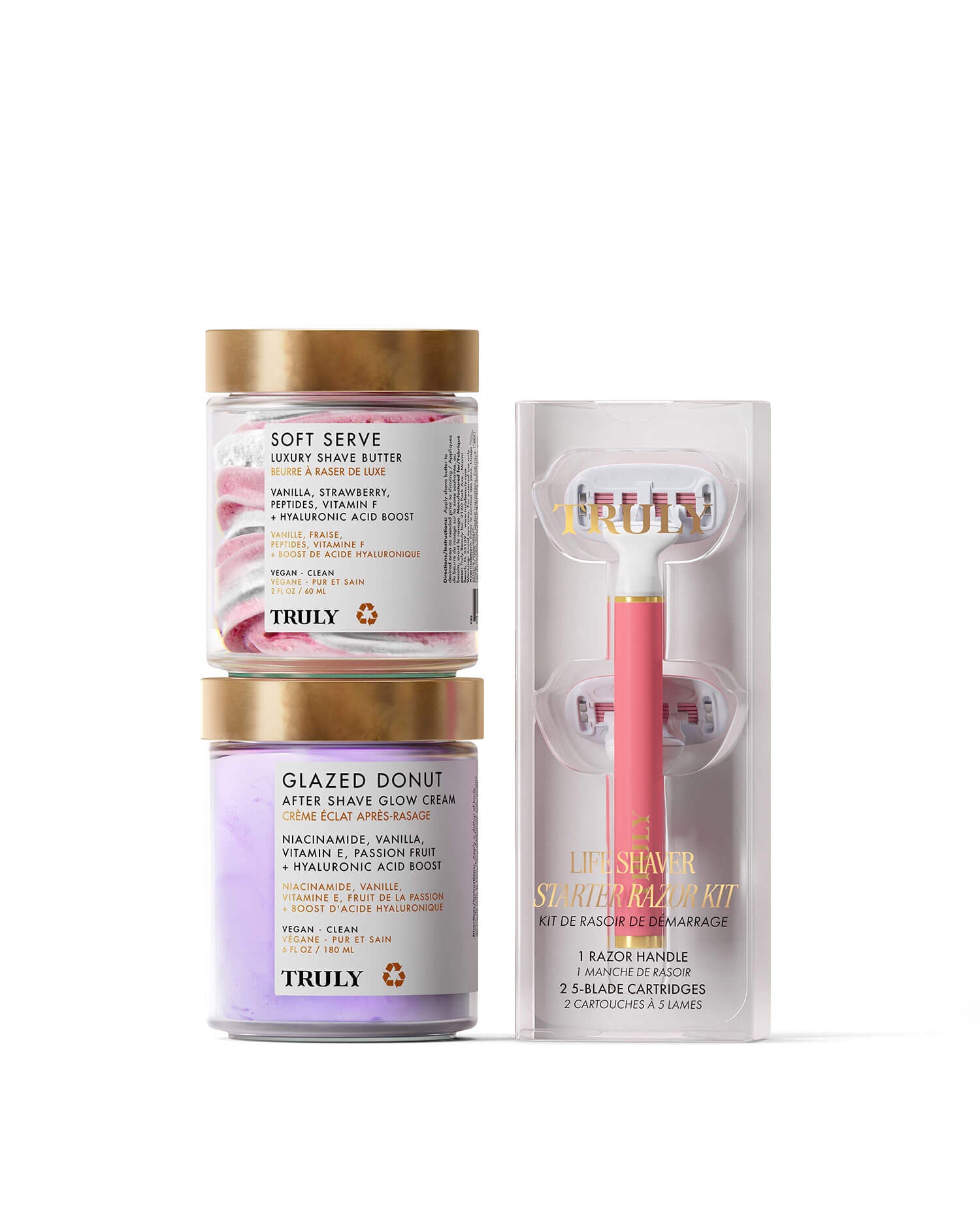 The Truly Beauty Glazed Donut Shave Duo, featuring two jars stacked beside a pink razor starter kit in clear packaging, sits against a light pink background—perfect for smooth skin and razor burn relief.