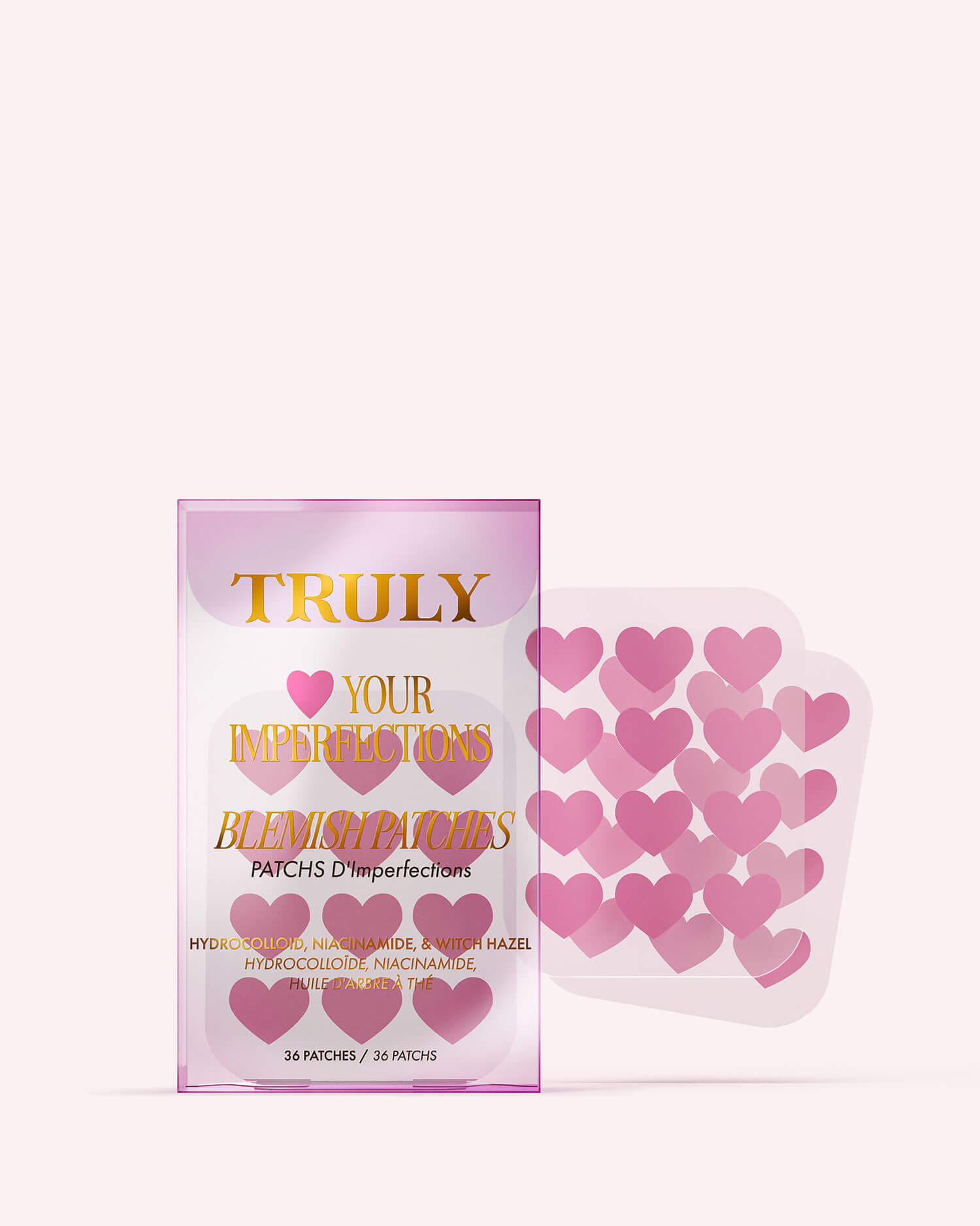 A package of Truly Beauty #Heart Your Imperfections Blemish Patches, featuring pink heart-shaped patches next to the pink and gold detailed box—a cute addition to your skincare routine.