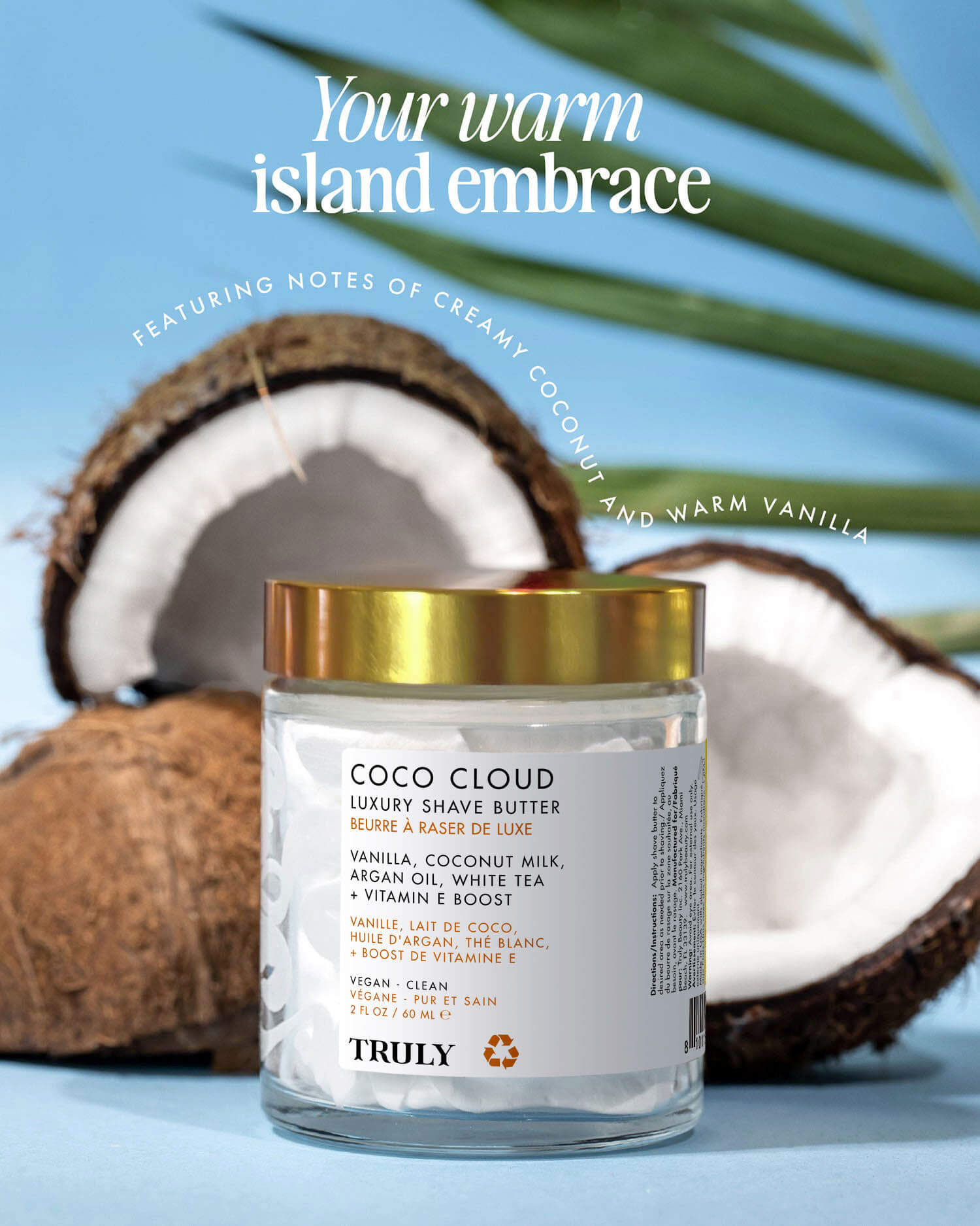 A jar of Truly Beauty Coco Cloud Luxury Shave Butter is displayed with coconuts and a palm leaf, highlighting its creamy coconut milk scent and smooth formula that helps prevent ingrown hairs.