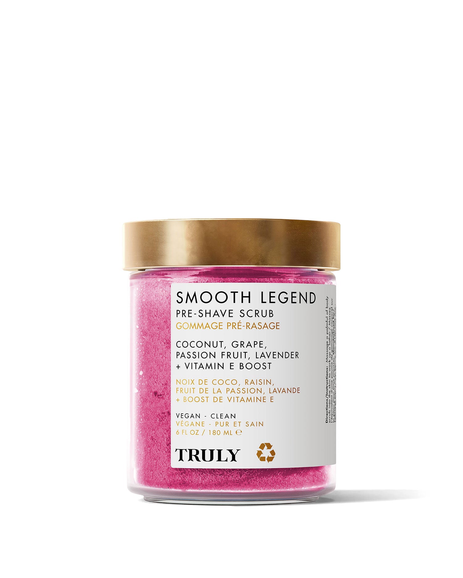 A clear jar of Truly Beauty’s Smooth Legend Pre-Shave Scrub with a gold lid holds 6 oz of bright pink, sugar-based scrub featuring coconut, grape, passion fruit, lavender, and vitamin E for radiant skin before shaving.