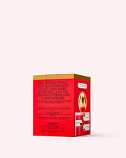 A rectangular red and gold box displays Truly Beautys Cherry Baby Eau De Parfum, highlighting black cherry and jasmine notes on its sides, set against a light pink background.