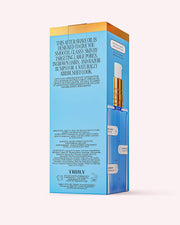 A blue and gold box of Truly Beautys Glass Skin After Shave Oil with bakuchiol displays details and ingredients; inside, a clear pump bottle is partially visible, promising glass skin after every shave.