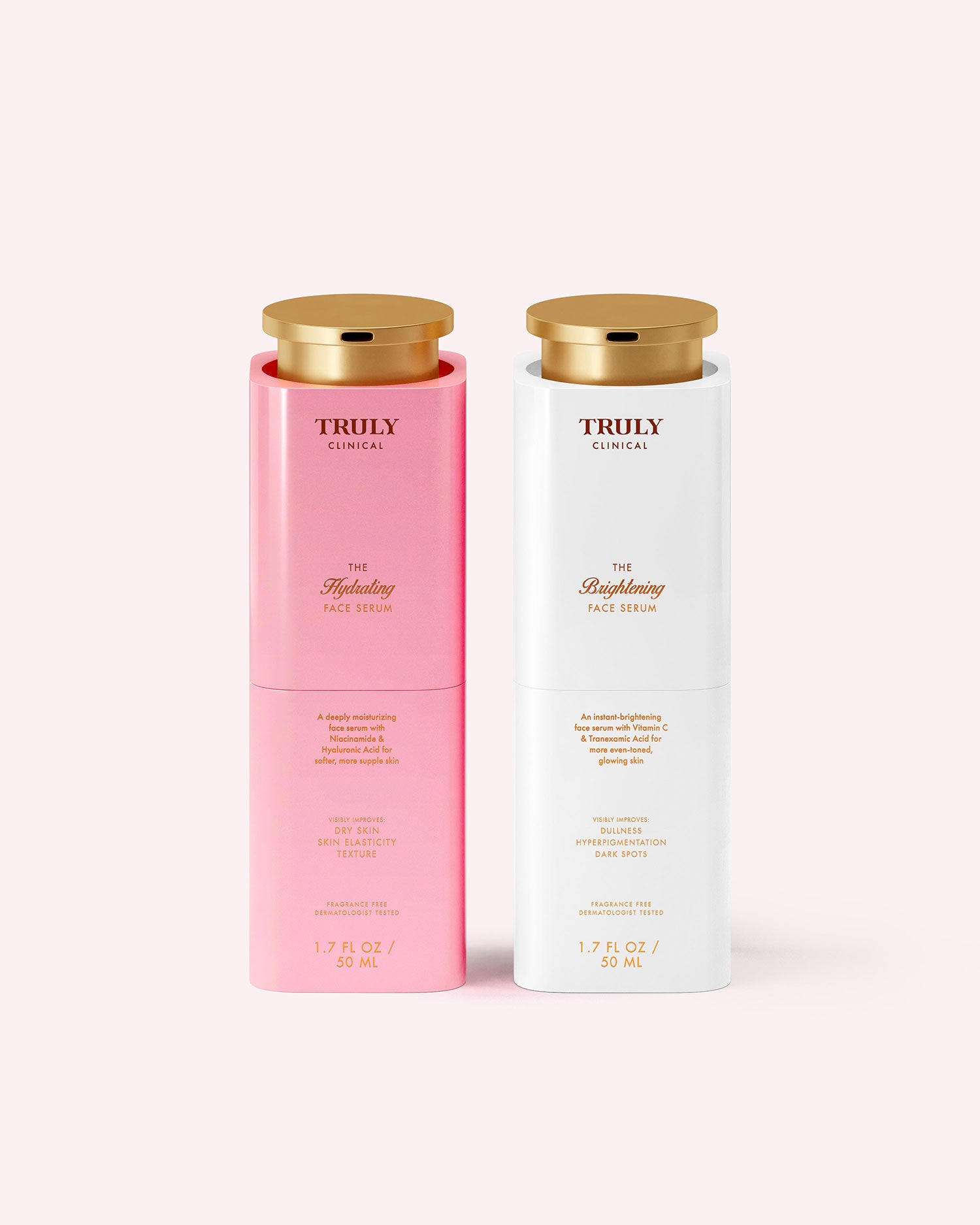 Two cylindrical bottles from Truly Beauty's The Face Serum Duo stand side by side, featuring elegant gold caps. The left is a pink hydrating serum with hyaluronic acid; the right, a white brightening serum with vitamin C.