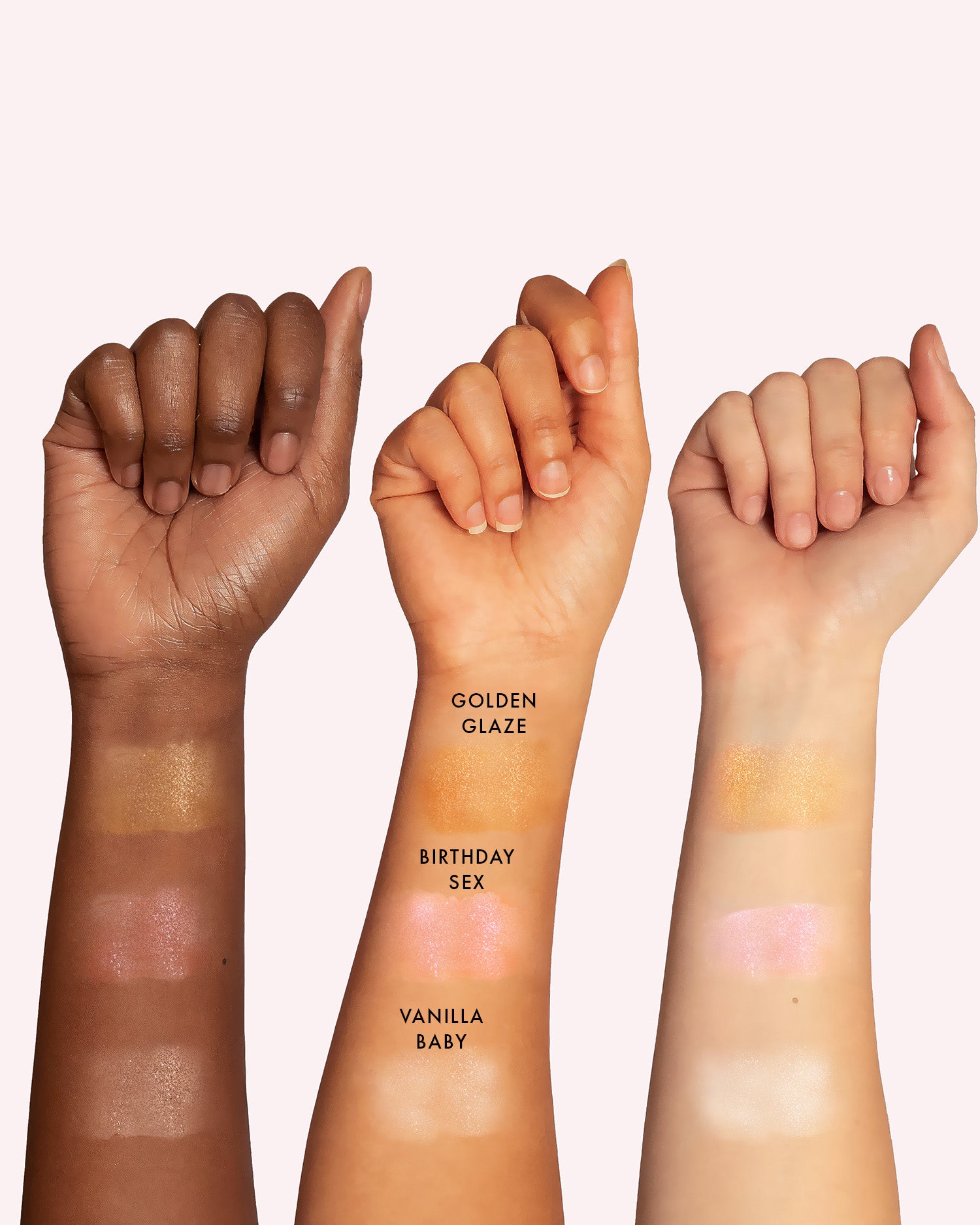 Three arms of varied skin tones display swatches of Truly Beauty’s Birthday Sex Shimmer Body Butter shades—Golden Glaze, Birthday Sex, and Vanilla Baby—labeled on the skin against a pale background.