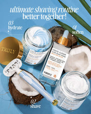 Flat lay of Truly Beauty’s Coco Cloud After Shave Moisturizer, arranged with coconut halves, a razor, and palm leaves on a blue background. Text reads “ultimate shaving routine.”.