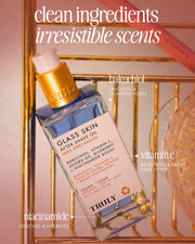 A bottle of Truly Beautys Glass Skin After Shave Oil rests on a gold wire rack, highlighting its blend of bakuchiol, vitamin C, and niacinamide—powerful ingredients featured in text overlays for glowing skin.