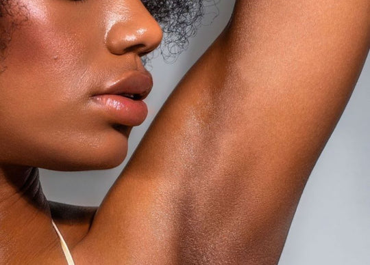 Why does my body hair grow so fast | Woman with arm behind head revealing hairy underarm