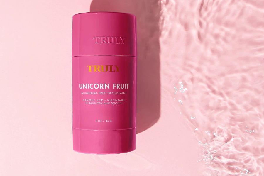 best aluminum free deodorant | truly unicorn fruit aluminum free deodorant on pink background with water
