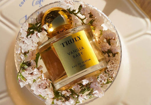 best vanilla fragrances | Truly's vanilla baby eau de parfum on glass plate with flowers