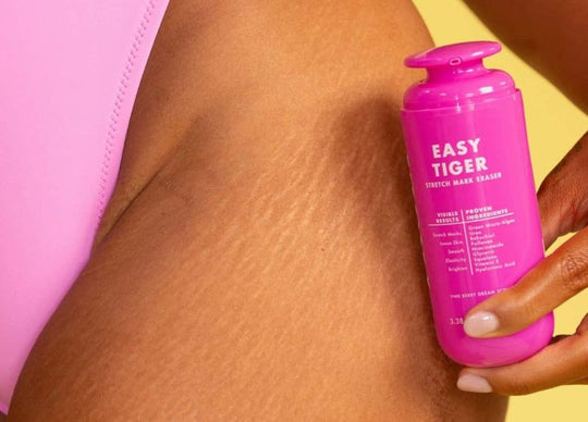 How to use a bikini trimmer | Woman's legs with Truly's Coco Cloud Shave products beside her