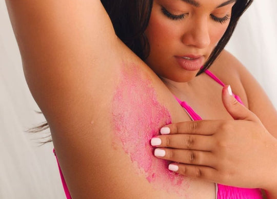 how often should you shave | woman shaving bikini line with pink razor holding Truly's glazed donut shave butter