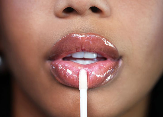 rosewater for skin | pink rose petals in glass teapot filled with water