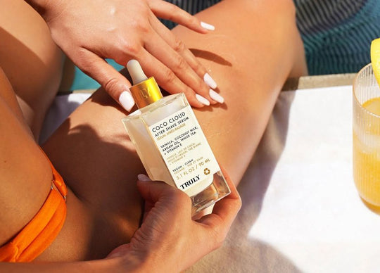 What to Put on Bikini Line After Shaving | woman applying Truly's cooka oil to bikini line