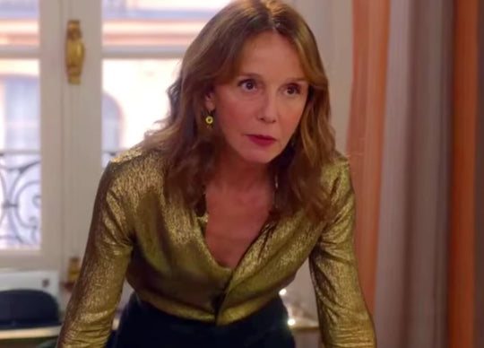 side by side photos of truly beauty advent calendar 2025 - left image shows pink calendar surrounded by two gold mini christmas trees and right image shows advent calendar with  a selection of truly products on bed