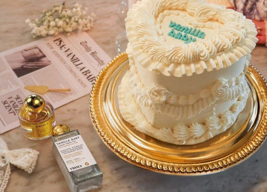 best vanilla fragrances | Truly's vanilla baby eau de parfum on glass plate with flowers