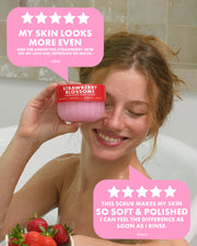 A woman in a bathtub holds up a pink jar of Strawberry Blossom facial scrub, with pink review bubbles overlaid on the image.