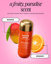 Laser Spot dark spot treatment bottle with mango and orange on a pink background