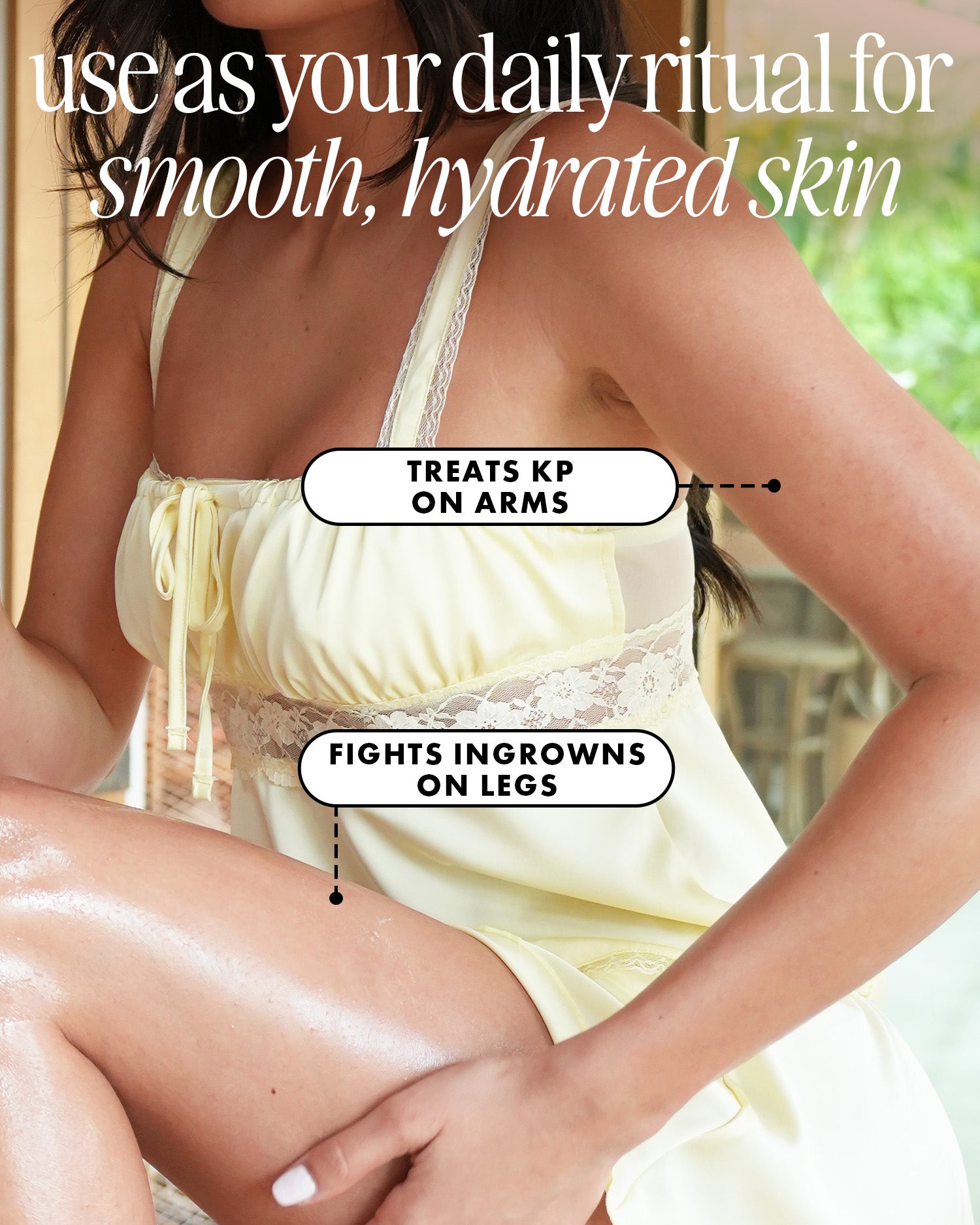 A woman in a pale yellow dress with smooth skin sits, one knee raised. Truly Beauty’s Smooth Legend After Shave Serum treats Keratosis Pilaris, fights ingrowns, and banishes strawberry skin for hydrated, silky results.