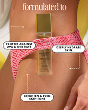 Suntan lotion bottle on a person's arm with text highlighting benefits