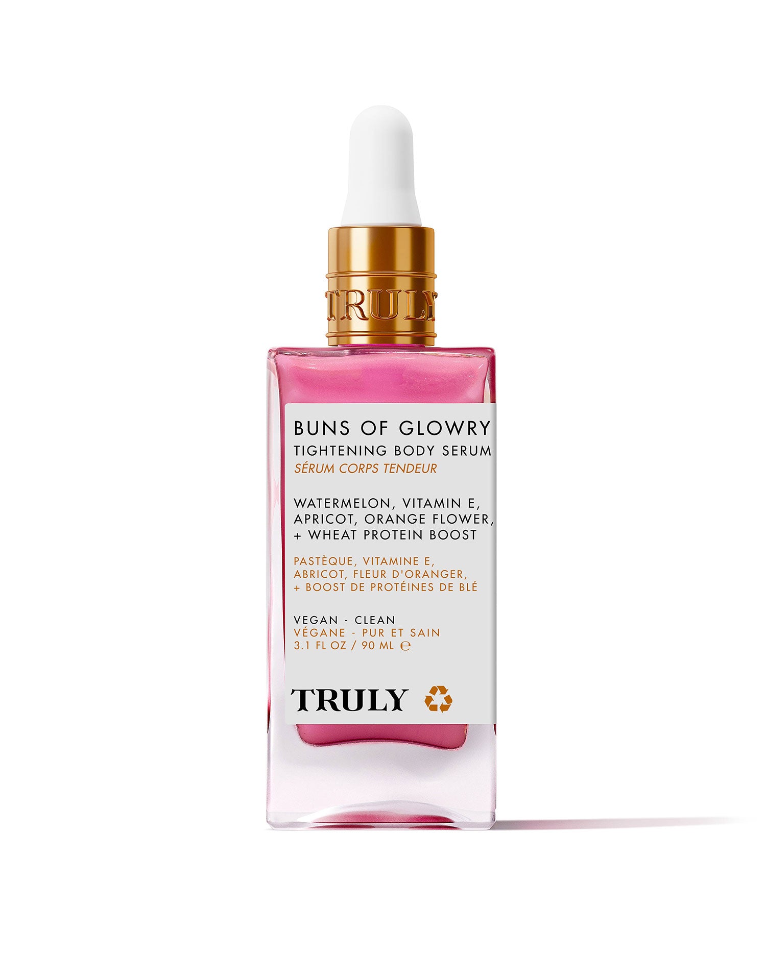 A pink and gold dropper bottle of Buns Of Glowry Tightening Body Serum by Truly, featuring ultra-hydrating serum with watermelon, vitamin E, apricot, orange flower, and wheat protein extract on a light pink background.