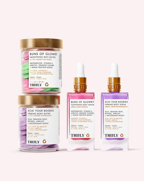 The Deluxe Body Routine by Truly Beauty includes two pastel butters—Buns of Glowry and Acai Your Boobies—and matching serums with gold droppers for butt and boobie skincare.