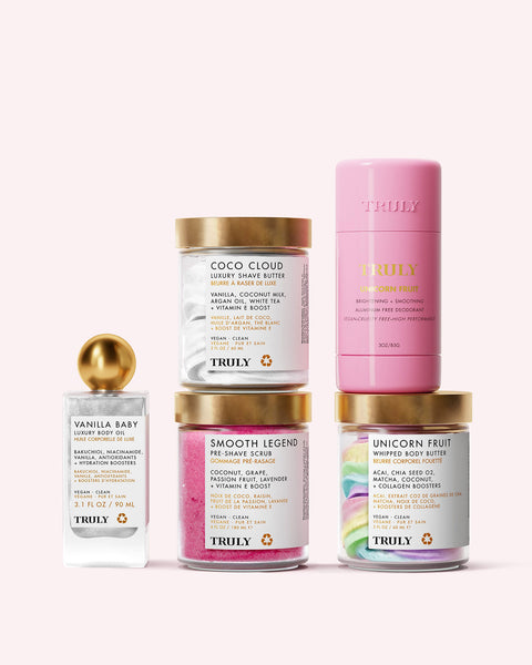 Kaylas Ultimate Routine by Truly Beauty features luxury body care essentials—shave butter, pre-shave scrub, whipped body butter, a mini body butter stick, and vanilla lotion—beautifully arranged on a light pink background for smooth, glowing skin.