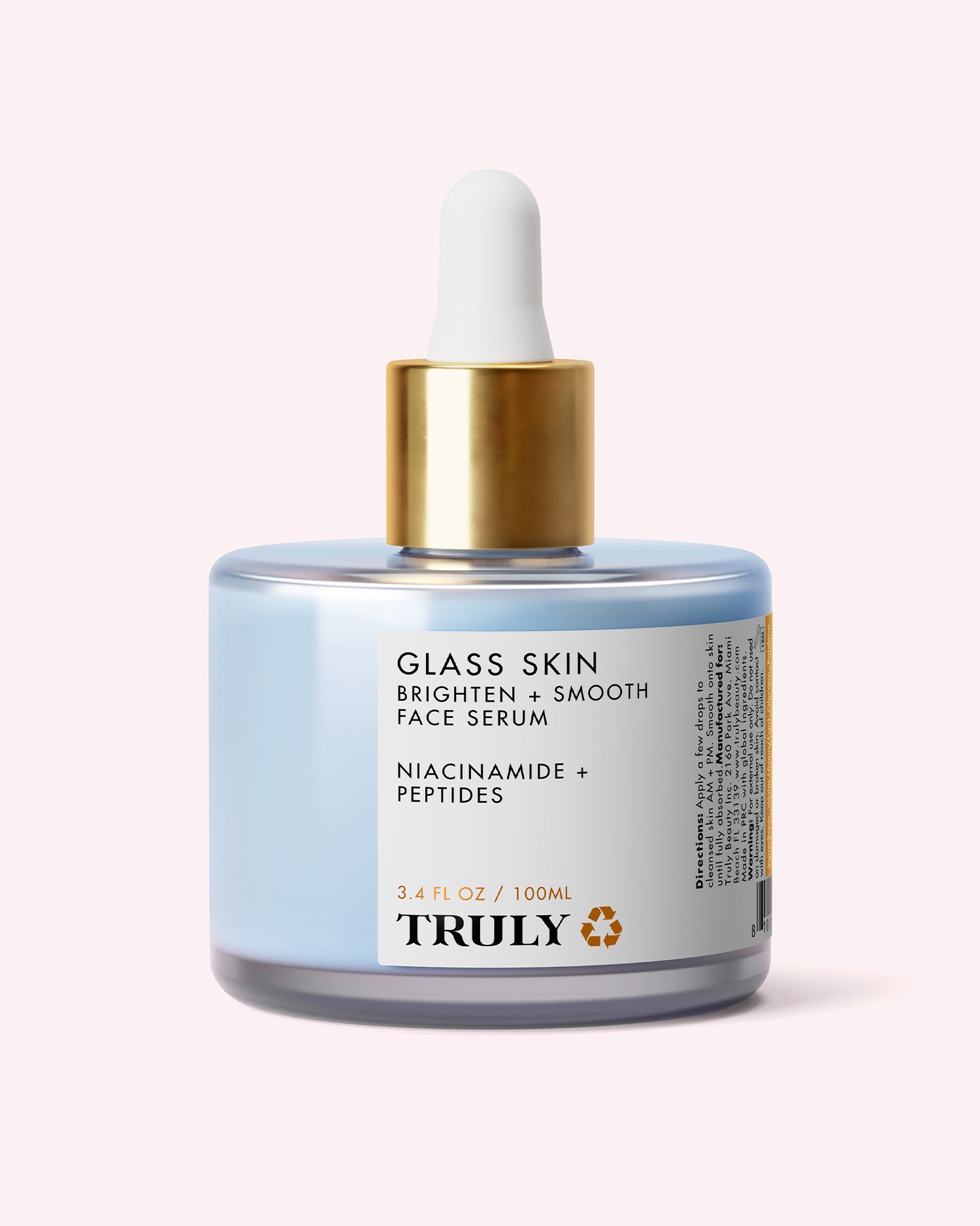 A 3.4 fl oz (100 ml) glass bottle of Truly Beauty’s Glass Skin Brighten + Smooth Face Serum features a gold dropper cap and a label highlighting niacinamide, peptides, and its hydrating formula designed to brighten and smooth the skin.