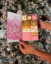 A person holds an open Truly Beauty 10 Days of Luxury Advent Calendar reading 