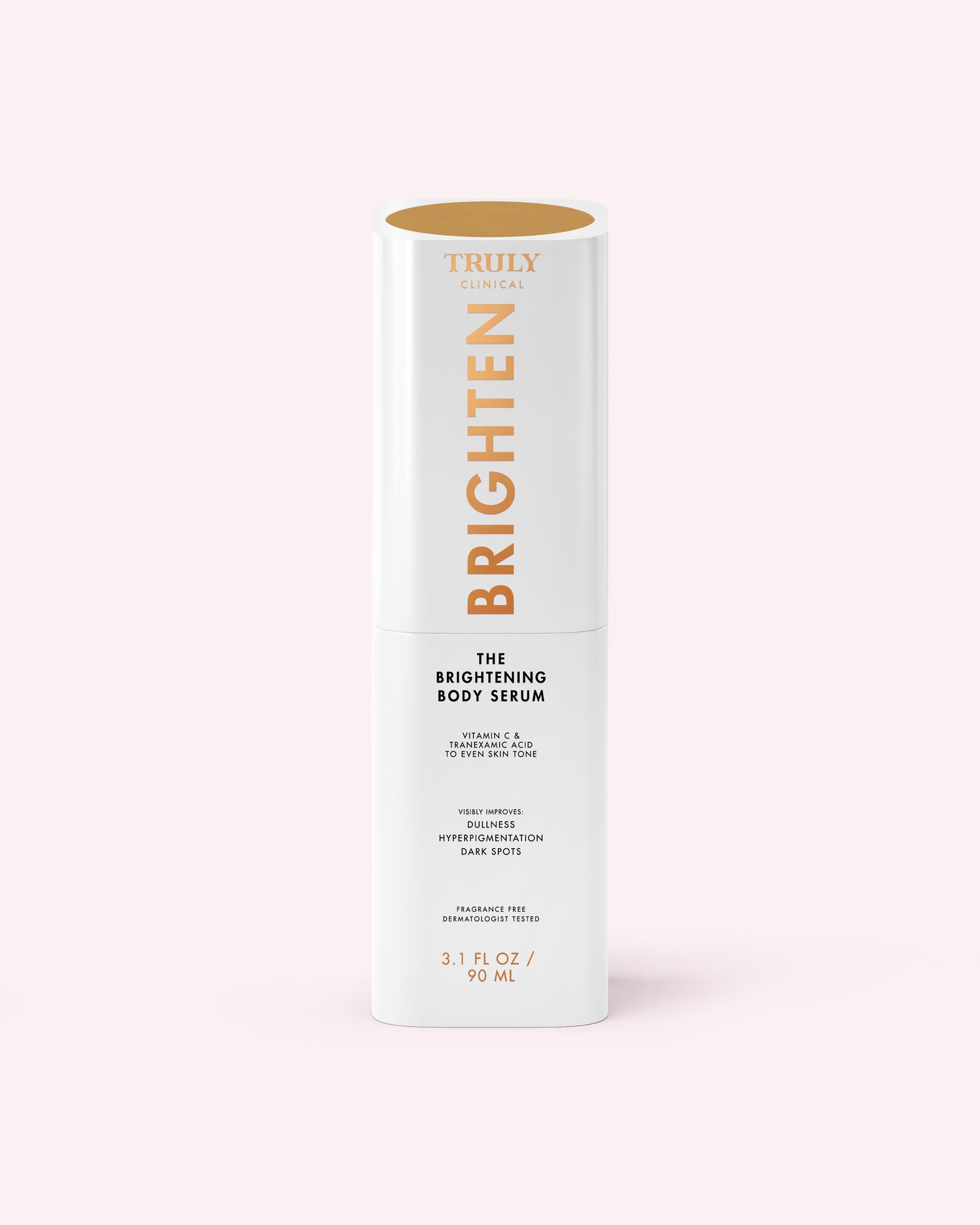 A white cylindrical bottle of The Brightening Body Serum by Truly Beauty, formulated to target dark spots, stands upright with gold and black text on a pale pink background.
