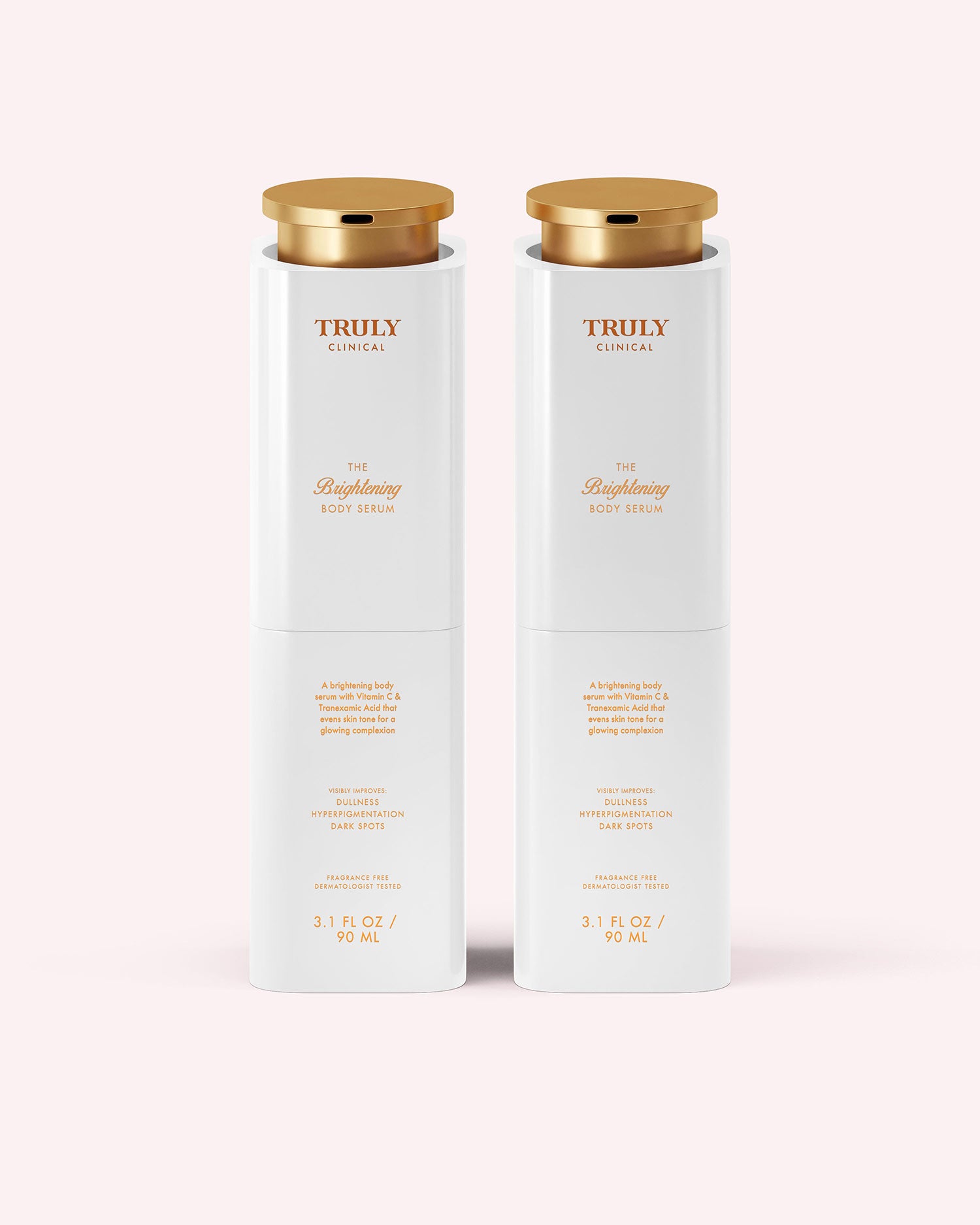 Two white bottles of Truly Beauty’s The Brightening Body Serum, 3.1 fl oz (90 mL) each with gold caps, stand side by side on a light pink background—ideal for targeting dark spots and hyperpigmentation.
