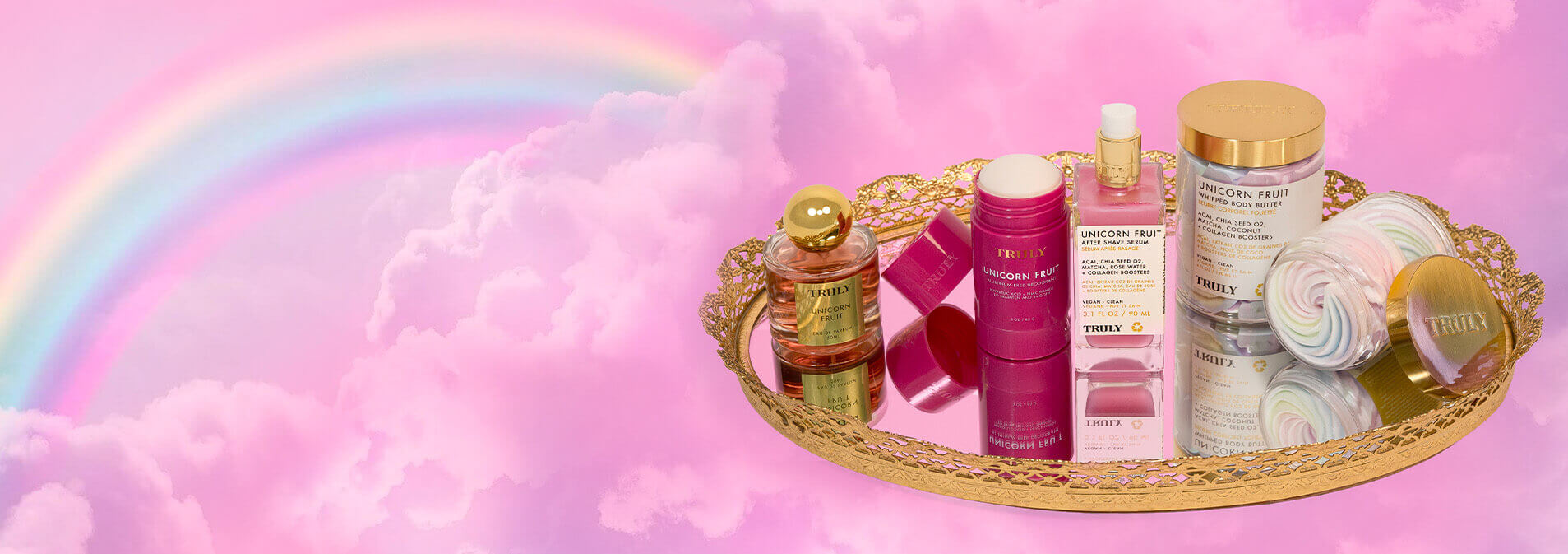 Cosmetic products on a tray with a rainbow and cloud background
