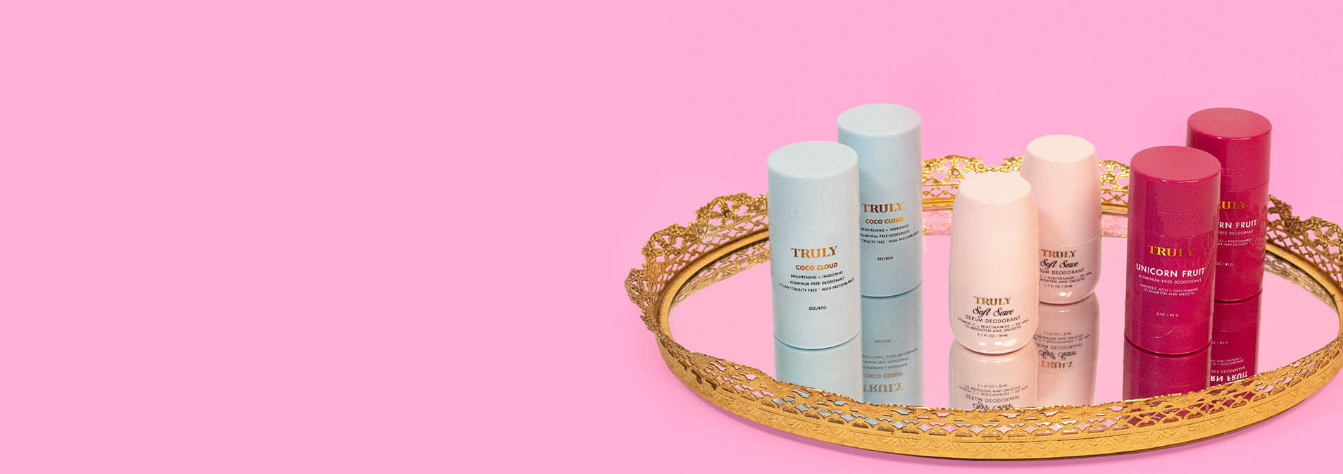 Set of 2 skincare deodorants on a decorative tray with a pink background for sale at 30