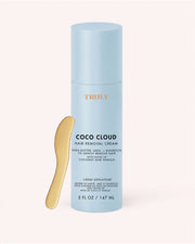 A light blue bottle of Truly Beauty’s Coco Cloud Hair Removal Cream, featuring a gold applicator spatula and available in a 5 fl oz size, is displayed against a plain background. This gentle yet effective formula from Truly Beauty delivers a smooth, easy hair removal experience.