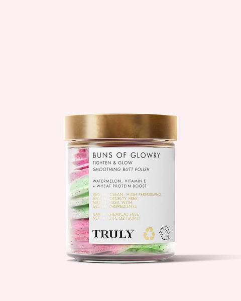 A clear jar with a gold lid holds swirled pink and green cream. The label says “Buns Of Glowry Smoothing Butt Polish” by Truly Beauty, a vegan, clean firming body scrub that tightens, smooths, and adds glow to skin.